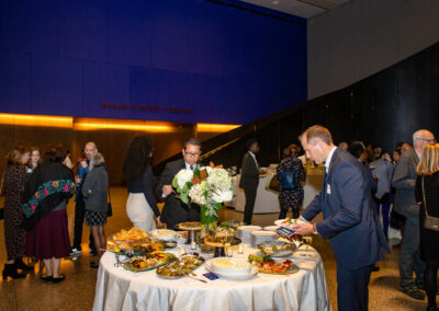 guests enjoying event at food table