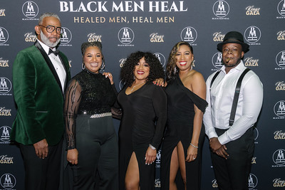 Black men heal team pose for photo